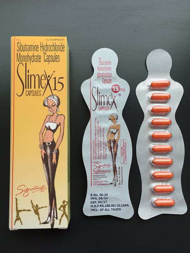 En la imagen hay una caja y un plato con tabletas Slimex de 15 mg.